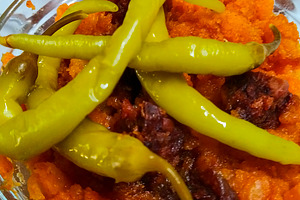 Spanish migas with chorizo and peppers in tavern setting, a Food & Drink Photo by DanFLCreativo
