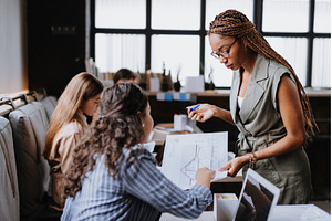 People in coworking space sharing, a Business Photo by HalfPoint