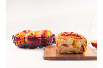 Peach cake loaf on wooden cutting