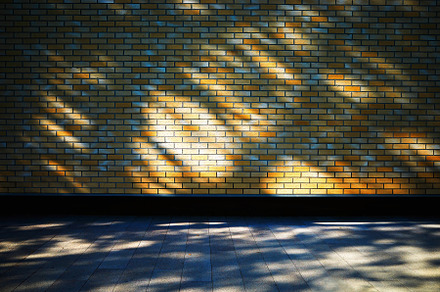 Dramatic light rays covering bricked street wall backdrop, an Architecture Photo by RETROWAVE '88