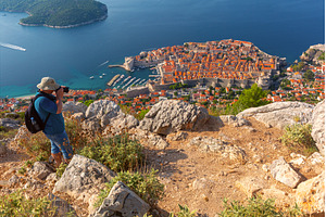 Photographer Above Old Town, an Architecture Photo by kavalenkava