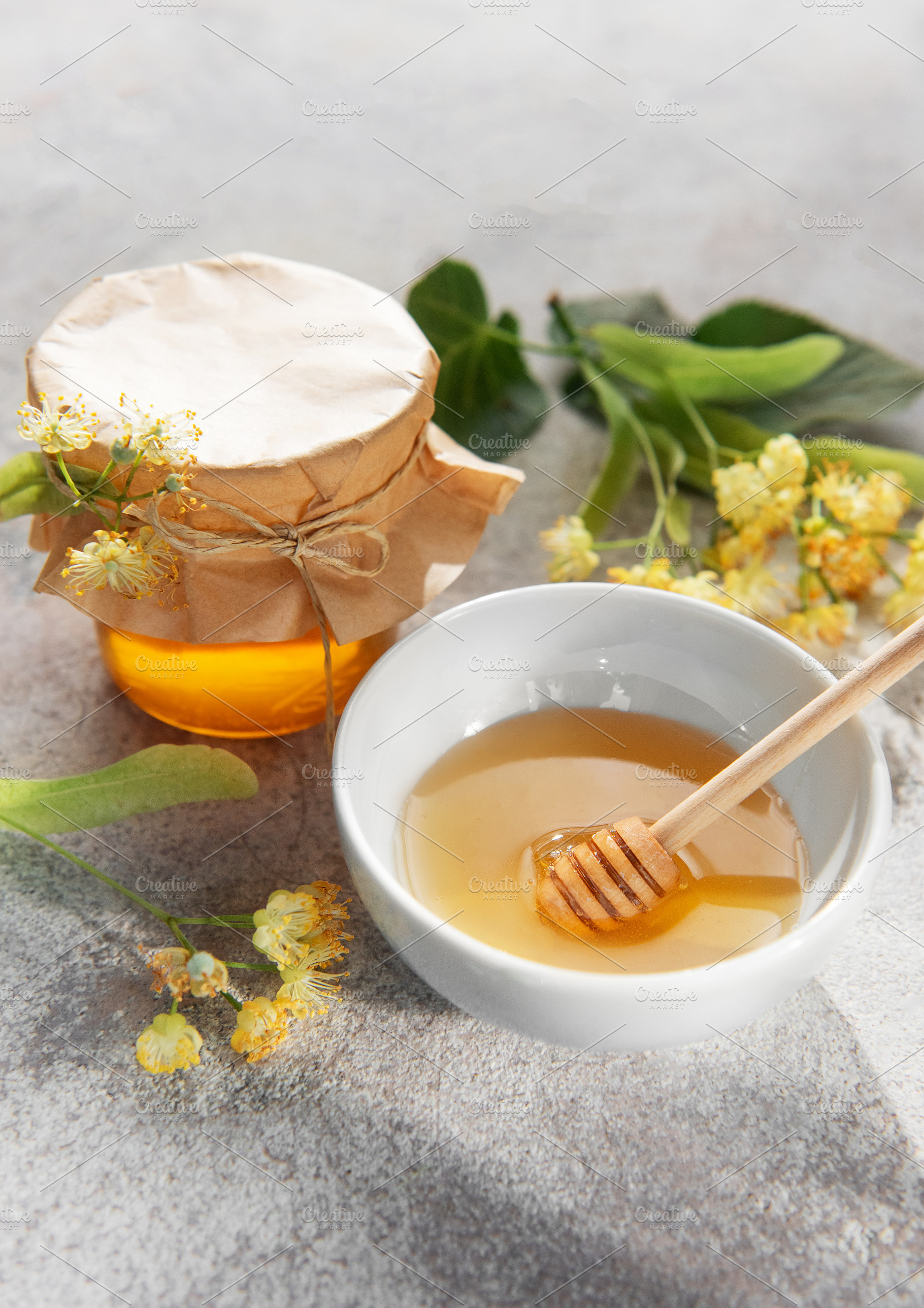 Fresh linden honey jar and bowl with dipper, a Food & Drink Photo by Olena Rudo