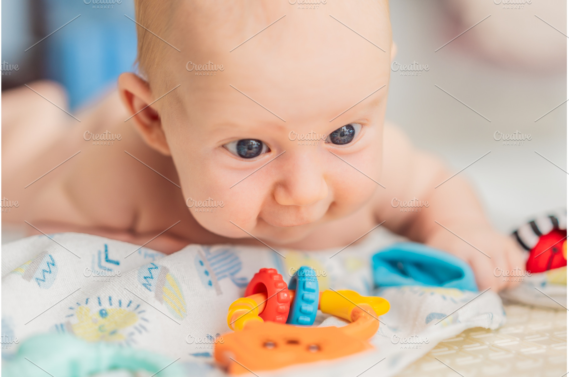 Adorable baby playing with colorful, a Person Photo by Elizaveta Galitskaya