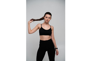 Fit woman in black sportswear, a Sports & Recreation Photo by volodymyrshtun13795