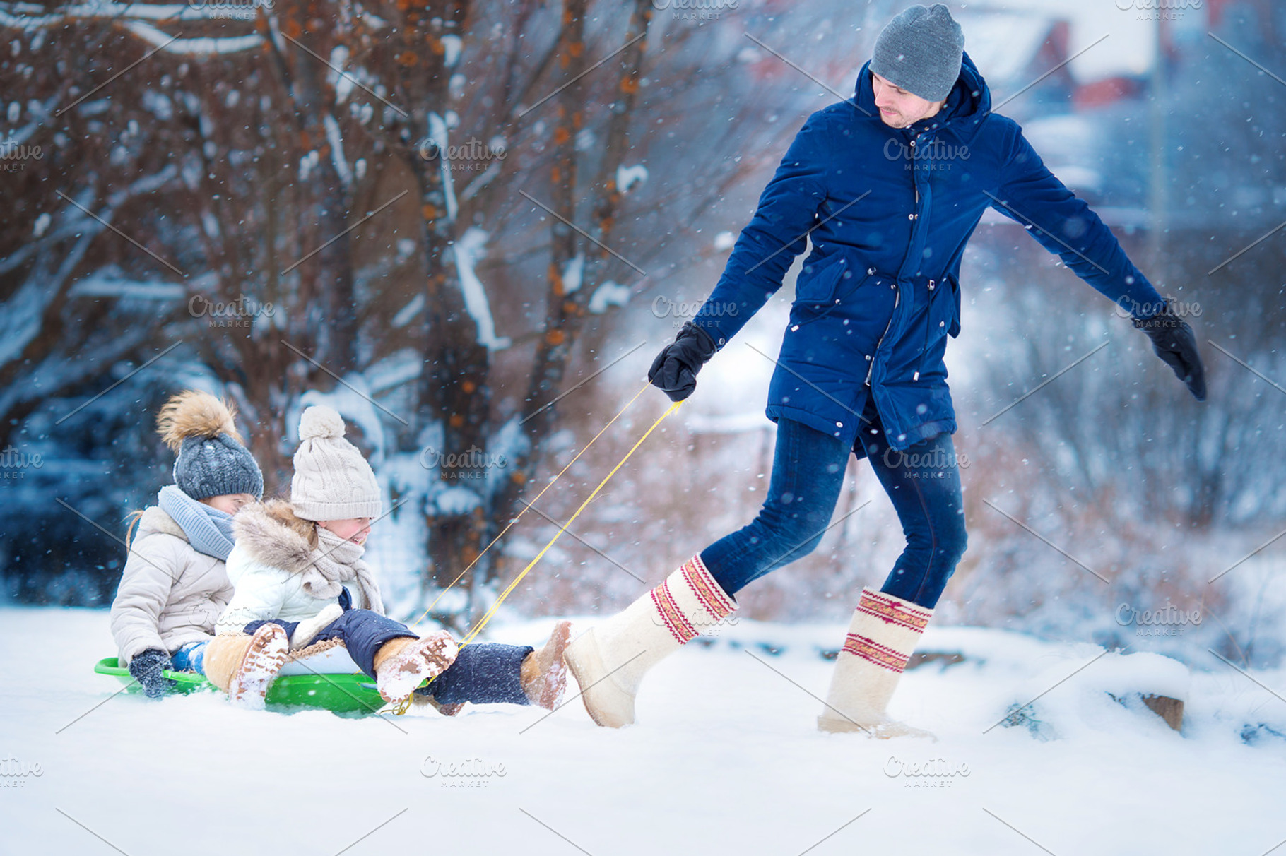 Little girls enjoying sledding father sledding his little adorable daughters, a Person Photo by travnikovstudio