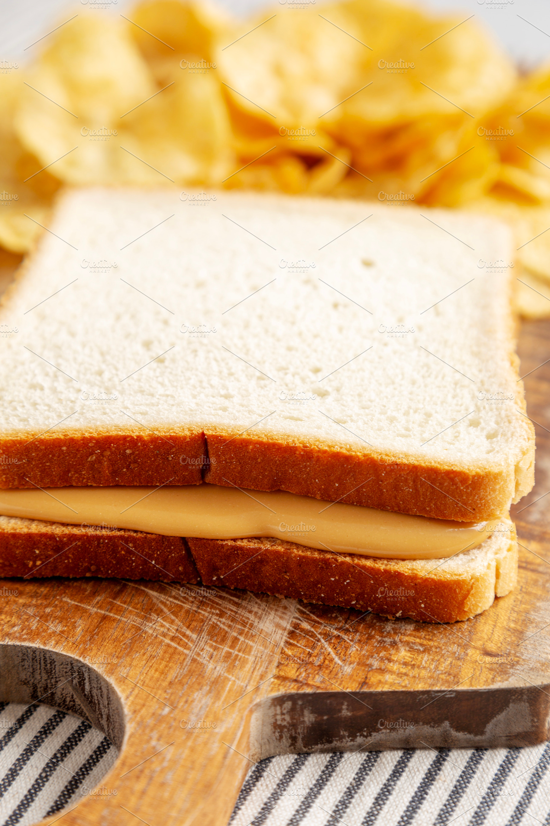 Homemade American Peanut Butter Sandwich on a Wooden Board, side, a Food & Drink Photo by LiudmylaChuhunova