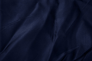 Close-up of crumpled dark blue textile with soft folds, ideal fo, a Background Photo by Ales Munt