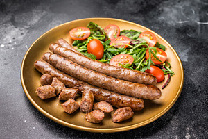 Close up of perfectly charred grilled sausage with salad, ideal, a Food & Drink Photo by composter-box@mail.ru