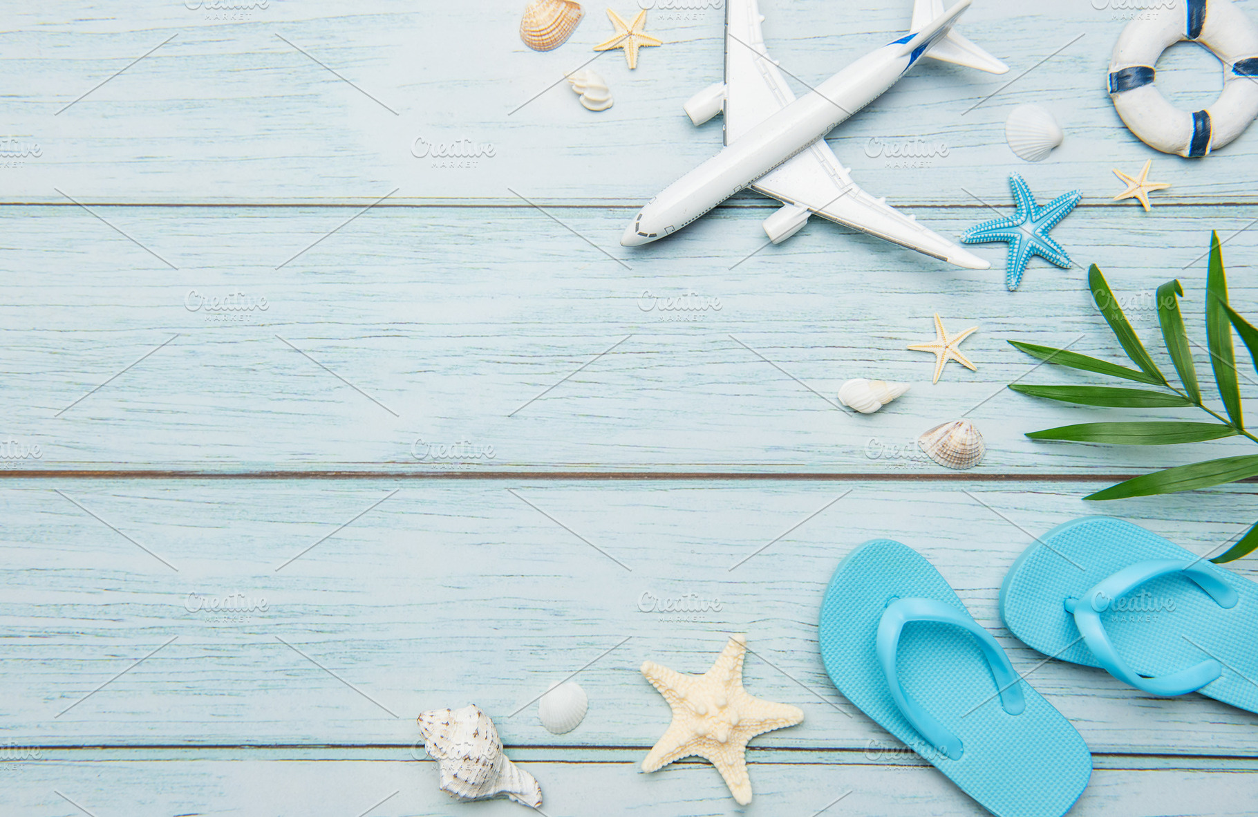 Planning summer vacation with airplane, flip flops and seashells, a Holiday Photo by Olena Rudo