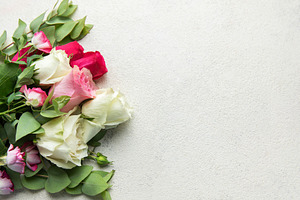 Roses bouquet with eucalyptus leaves on concrete background, a Holiday Photo by Olena Rudo