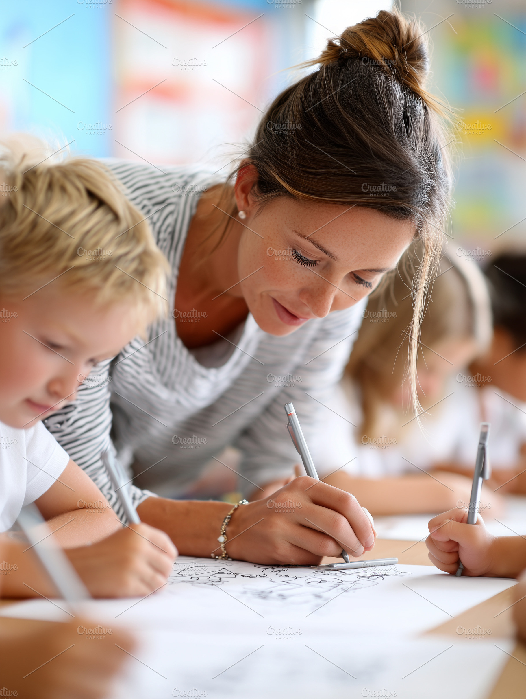 Teacher helping young children with, a School & Education Photo by MistyDay