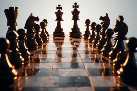 chess battle on chessboard, a Photo by ComfortQ