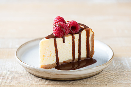 Slice of cheesecake with chocolate, a Food & Drink Photo by The baking man