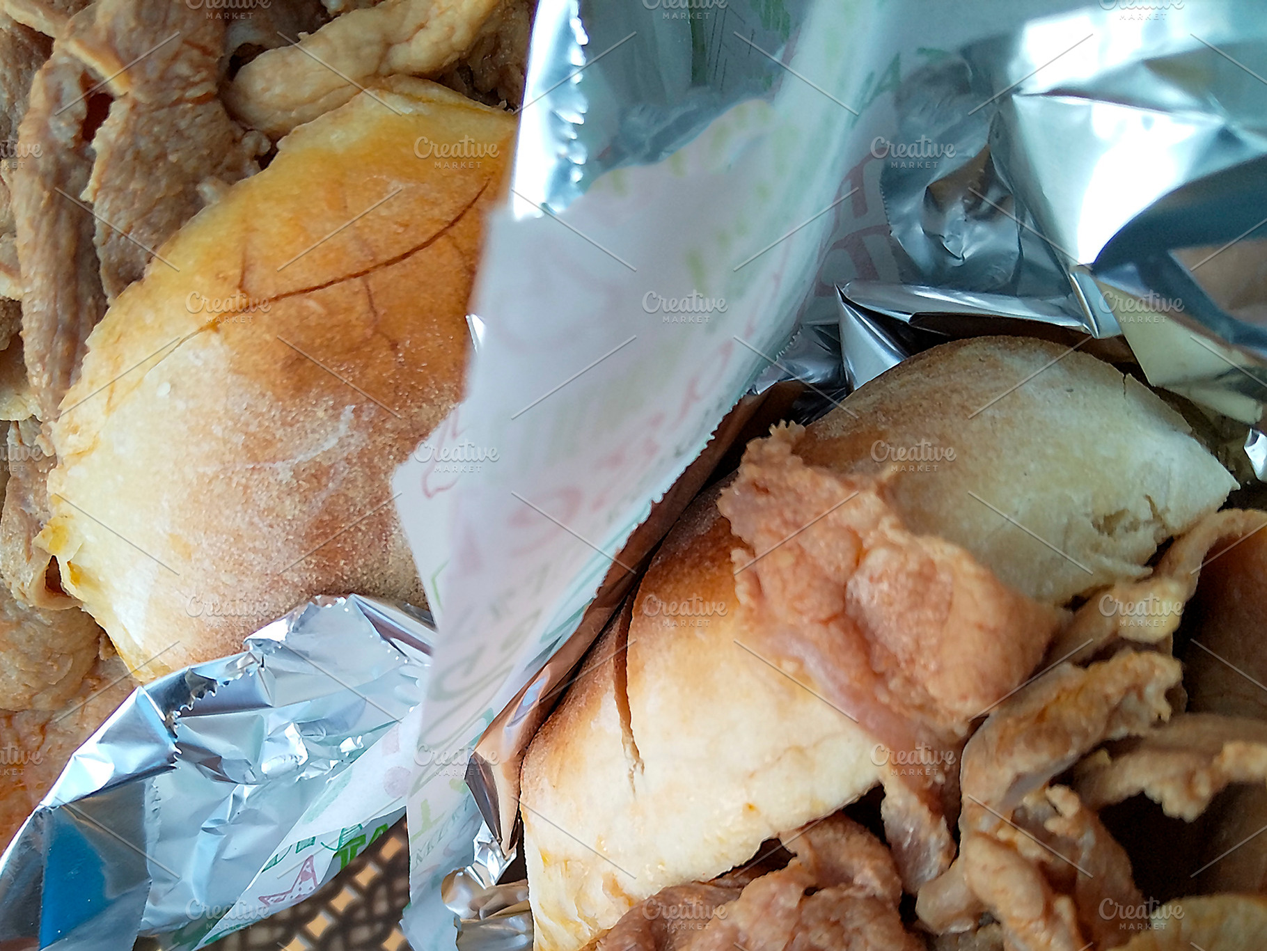 Doner kebab wrap in foil close-up, a Food & Drink Photo by DanFLCreativo