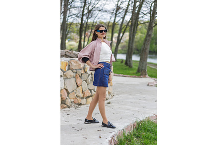 Young woman in pink jacket and denim, a Person Photo by serkum