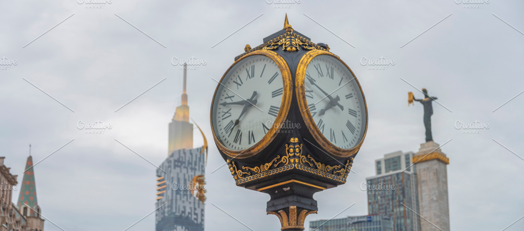 Vintage street clock close up at Europe Square with Medea statue, a Photo by Pictures for you!!!!!!!!!