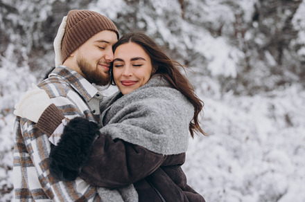 Portrait of a young happy and loving couple having fun in a snow, a Person Photo by Cherkas Photography