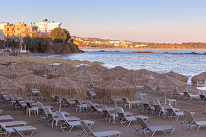 Empty Sun Loungers and Thatched