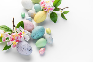 Pastel colored eggs and plum blossoms for easter, a Holiday Photo by Olena Rudo