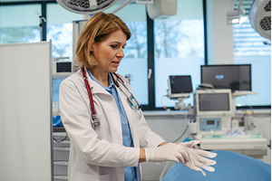 Female doctor is preparing for, a Health & Medical Photo by HalfPoint