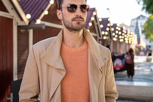 Man wearing sunglasses standing in front of decorated house, a Person Photo by andreonegin market
