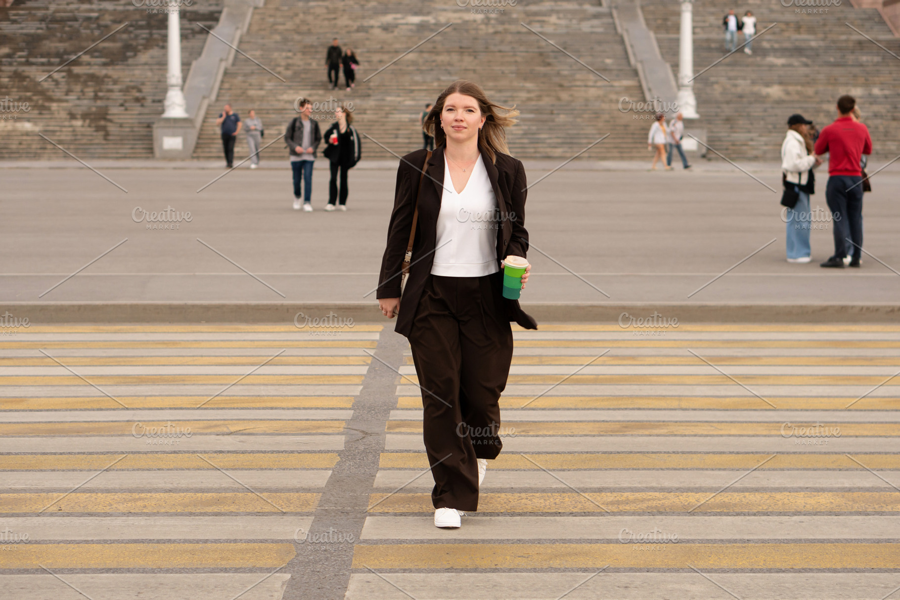 Young woman walking confidently, a Person Photo by Elena Vagengeim