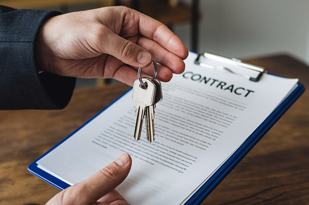 A persons hand holds a set of keys