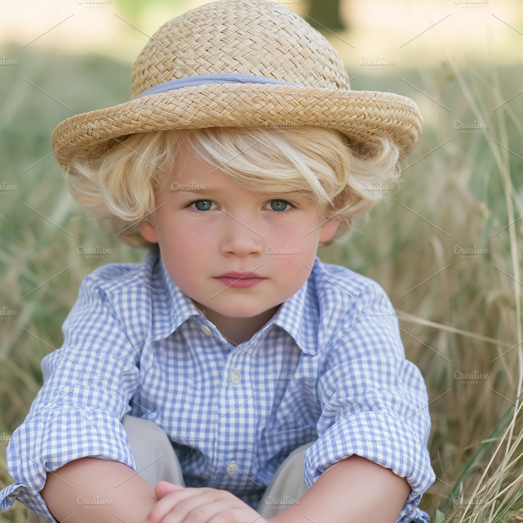 Young boy with blond hair and blue eyes wearing a straw hat and, a Person Photo by Studio ANNA
