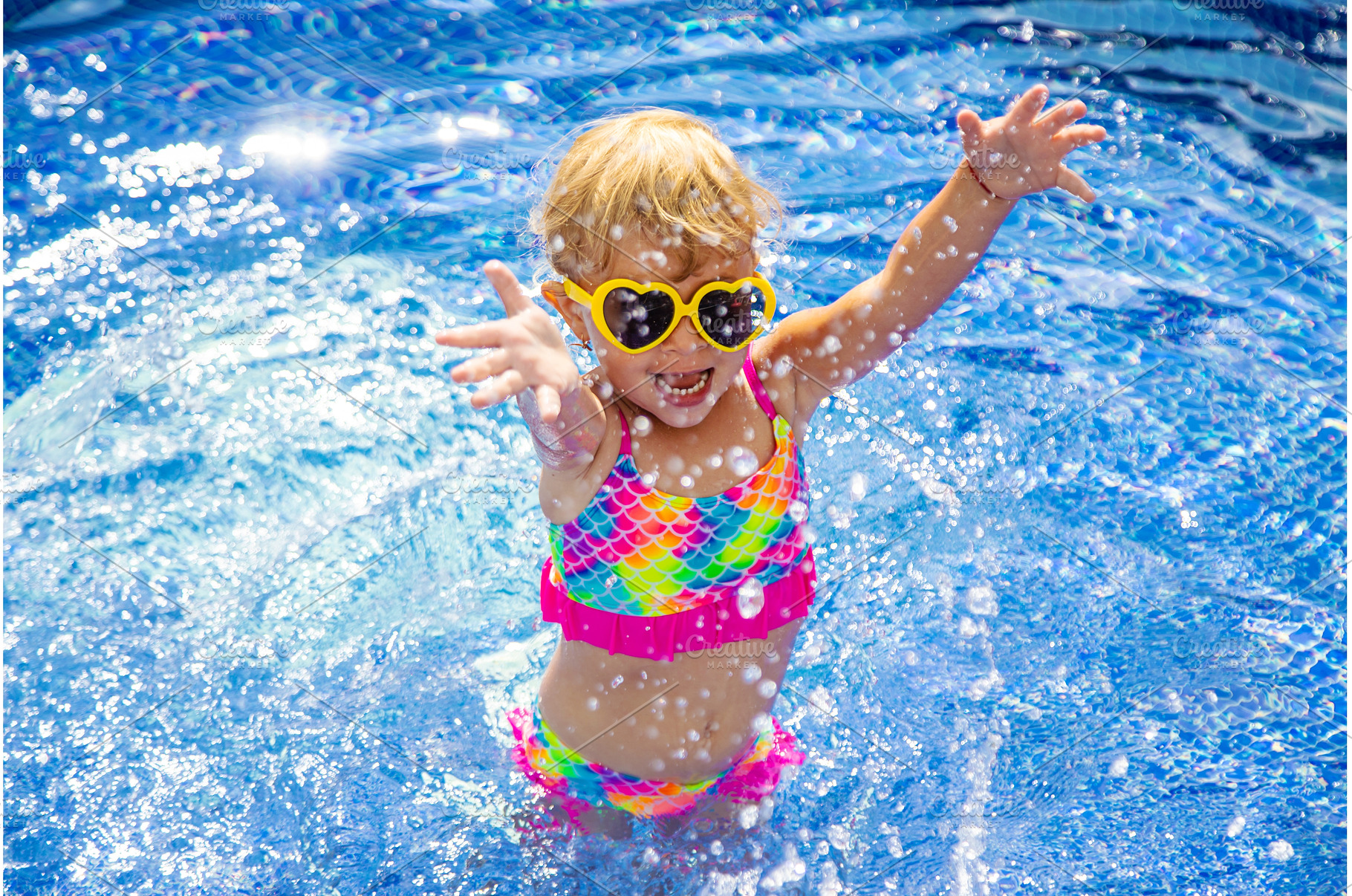 Child near the pool in sunglasses, a Sports & Recreation Photo by yanadjana