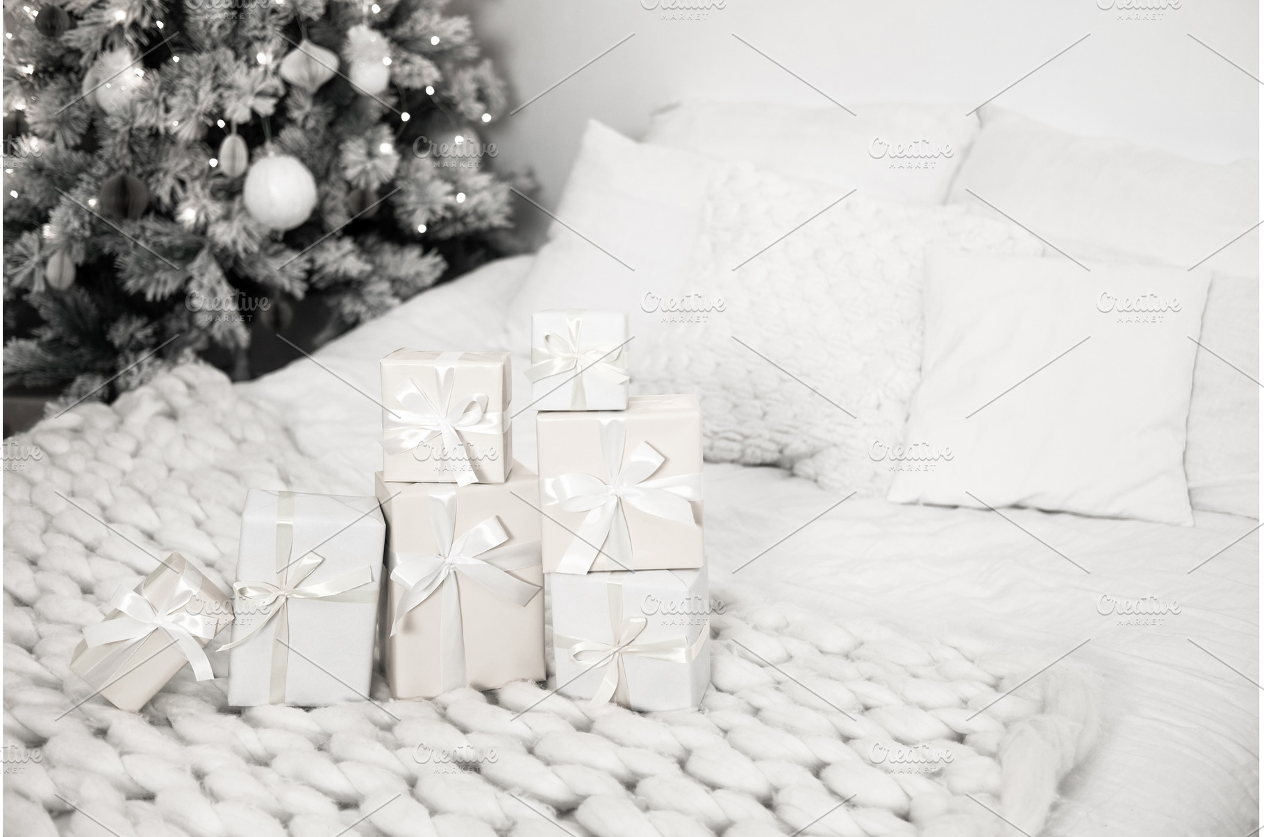 Christmas presents lying on cozy, a Holiday Photo by Anna Efetova