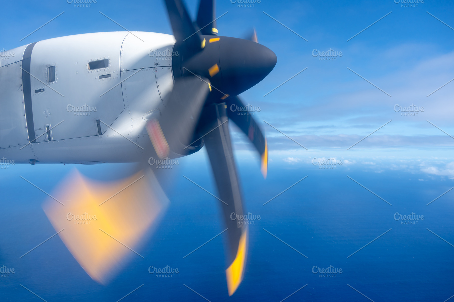 Aerial view of the Pacific Ocean with a spinning propeller, a Photo by GoodGoods