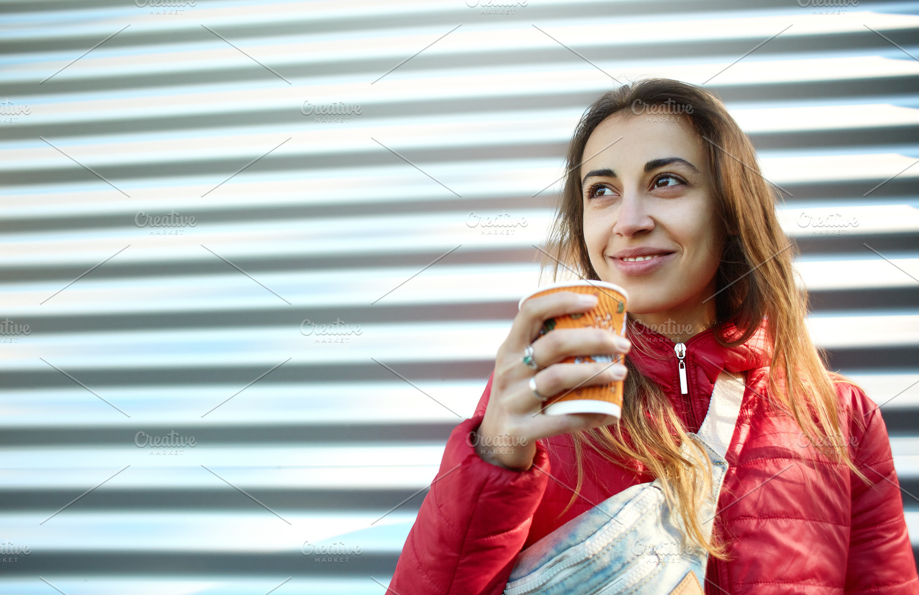 Young woman in red jacket with blue stock photo containing woman and girl, a Person Photo by vitaliymateha photography