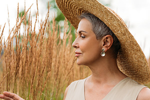 Side view of a senior woman in hat, a Person Photo by Artem Varnitsin