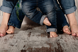 Family barefoot containing family, generation, and jeans