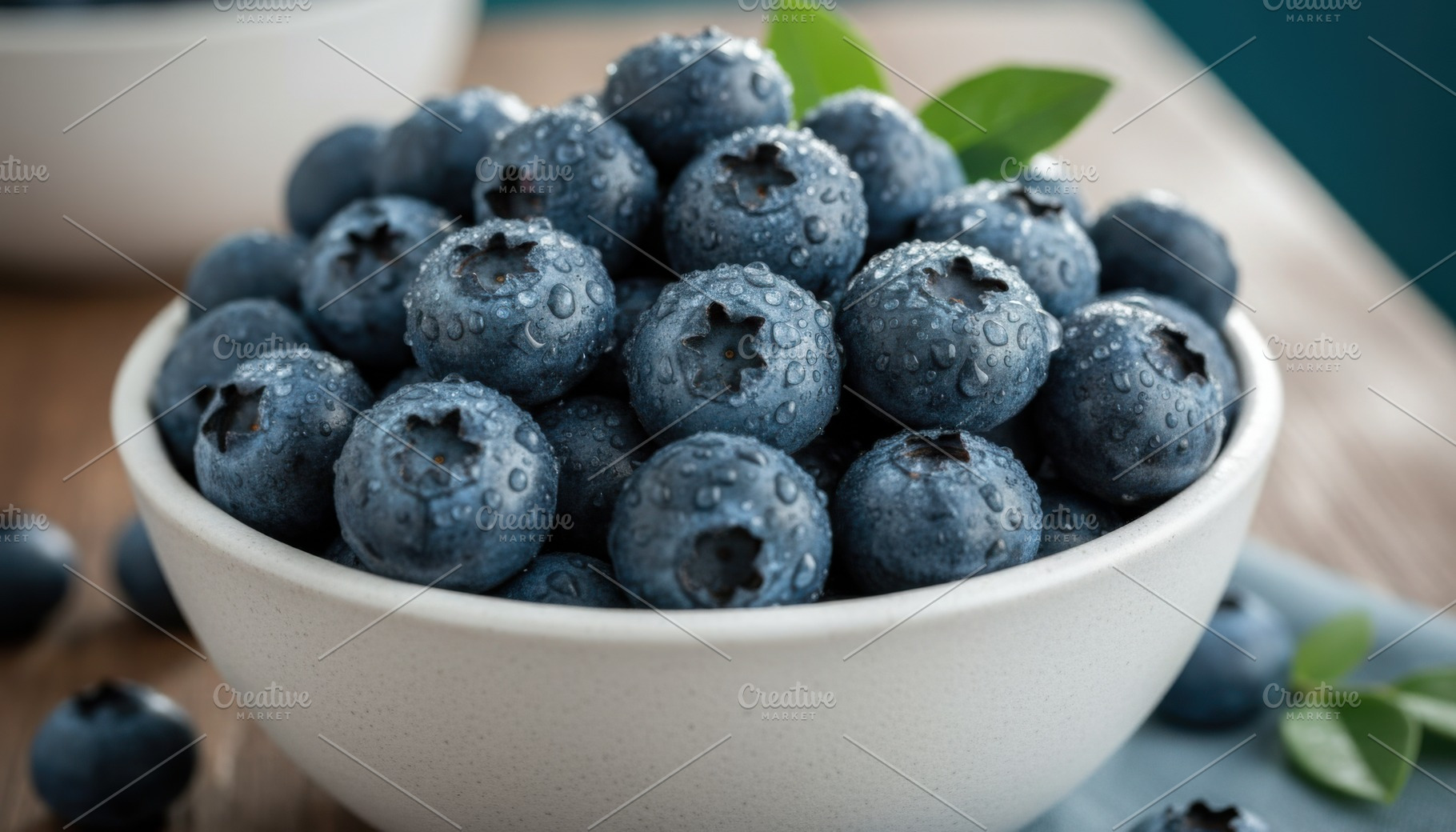 Plump blueberries in a bowl with mint leaves, a Food & Drink Photo by Igor Tichonow