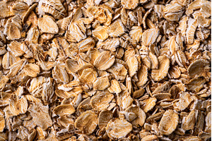 Textured oatmeal grains on white, a Food & Drink Photo by Yulia Furman