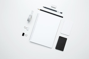 On a white background, an empty mock up notebook, white and black cards, and mo, a Photo by matucha