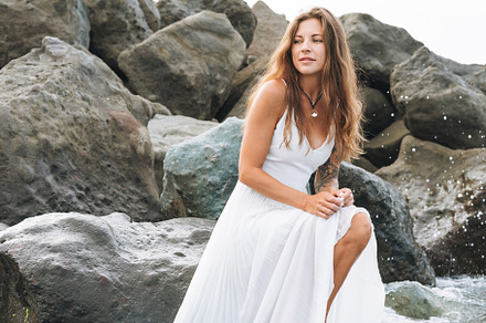 Young woman in white dress on beach, a Person Photo by Galina_Zhigalova