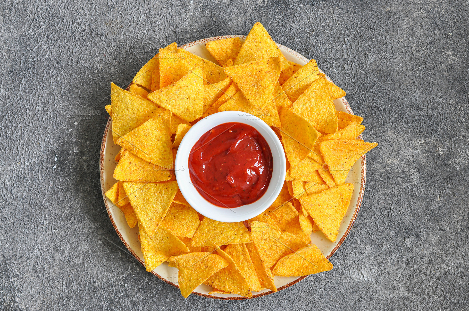 Corn tortilla chips in big plate., a Background Photo by Galiyah Assan