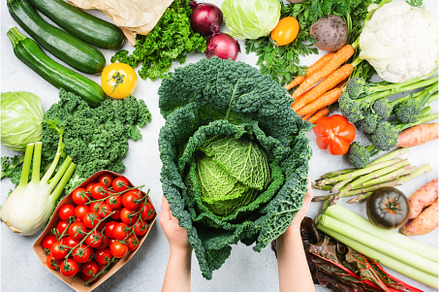 Organic vegetables on white table