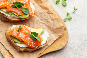 Salmon avocado toast with cream cheese and greens, a Food & Drink Photo by Olena Rudo