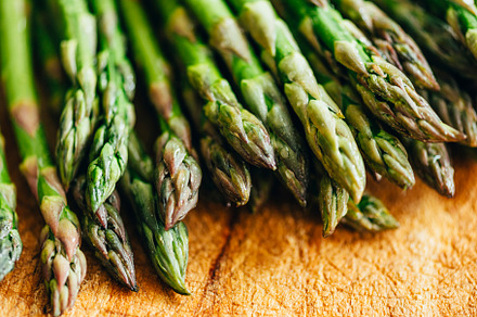 Closeup of fresh green asparagus on, a Background Photo by hitdelight