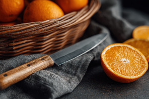 Oranges are on a table near a basket, a Photo by Beautiful things