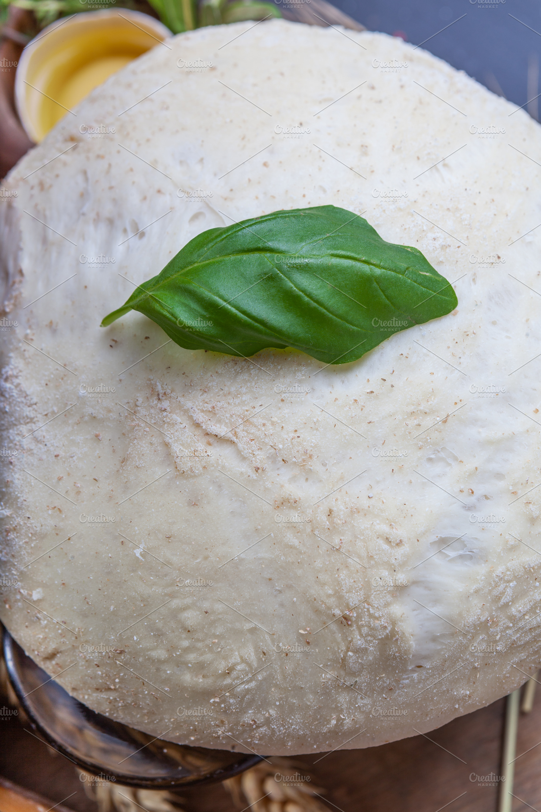 Pizza dough with egg, herbs and flour, a Food & Drink Photo by eleana