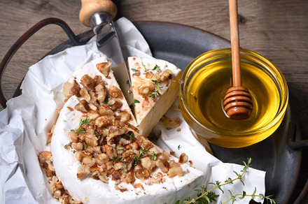 Camembert cheese with honey, a Food & Drink Photo by Apolonia