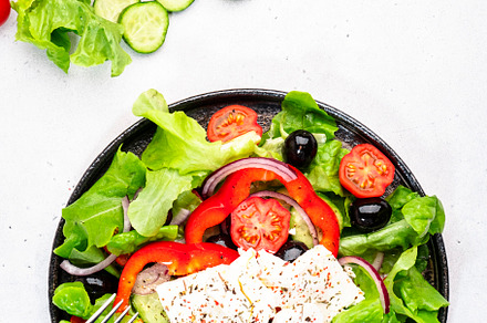 Greek salad with feta cheese, black olives, tomatoes, paprika, c, a Food & Drink Photo by 5PH