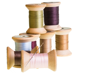 Row of thread spools with reflection preview 6