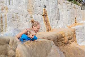 Mother and her toddler bathing in, a Nature Photo by Elizaveta Galitskaya