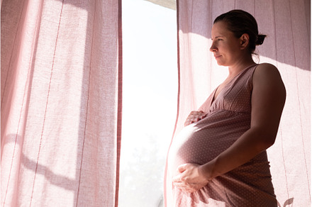 Pregnant woman touching belly, a Person Photo by Koldunova