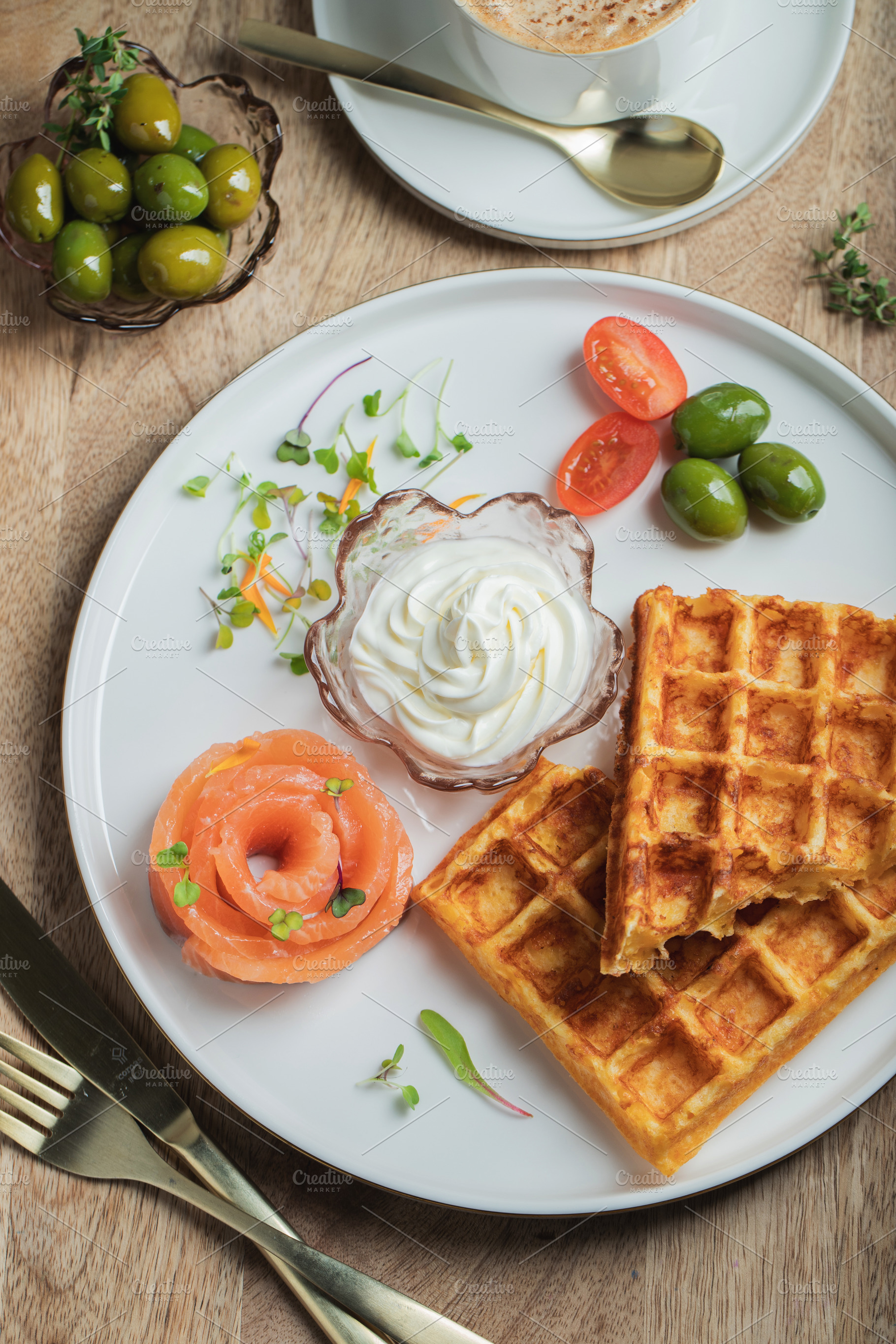 Crunchy waffle fries with sour cream dip served in a basket, a Food & Drink Photo by Budarinphoto